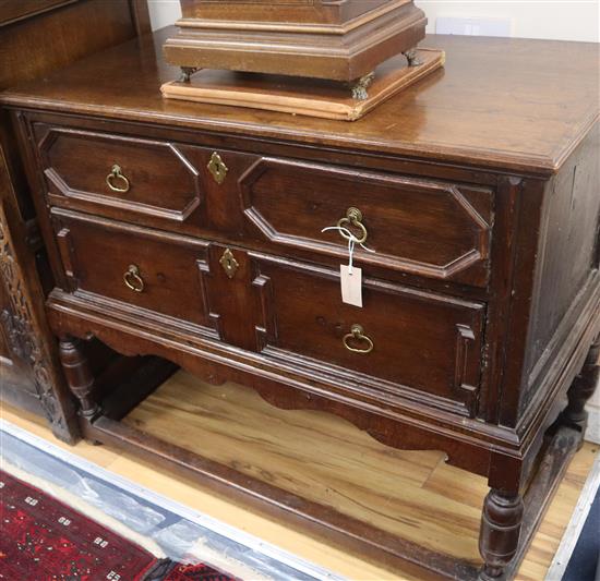 A pair of 1920s 17th century design oak two drawer geometric moulded chests on stands W.106cm